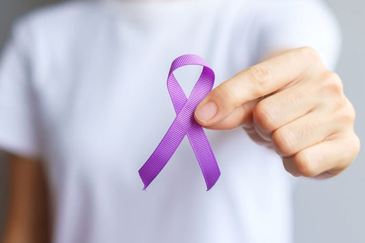 A women holding purple ribbon for Fibromyalgia Awareness purpose.